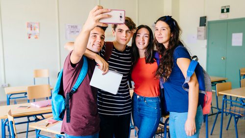 1group friends taking selfie classroom