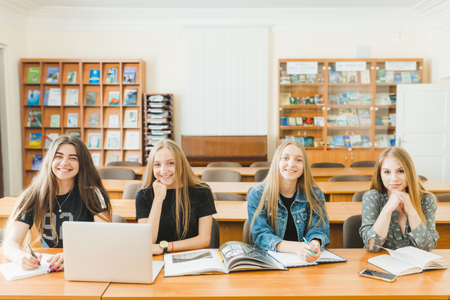 cheerful teenagers classroom