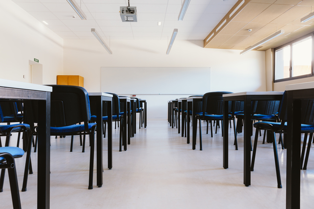 White classroom in education university with blue chairs