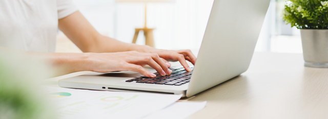 Freelance young Asia businesswoman casual wear using laptop working in living room at home. Working from home, remotely work, self isolation, social distancing, quarantine for corona virus prevention.