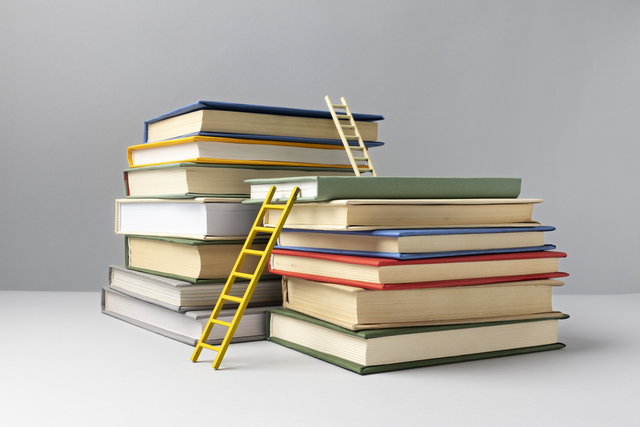 front view stacked books ladders education day